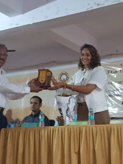 Receiving a plaque of appreciation after being a chief guest and speaker at an inter collegiate event. It is an honor to be recognized by educational institutions for my work in the field.