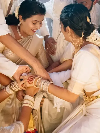 A beautiful moment from a Bunt wedding ritual, where family members come together to bless the couple.