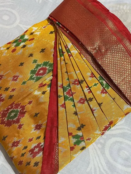 A vibrant yellow Pochampally ikat saree. My pleating technique ensures the unique pattern is displayed beautifully.
