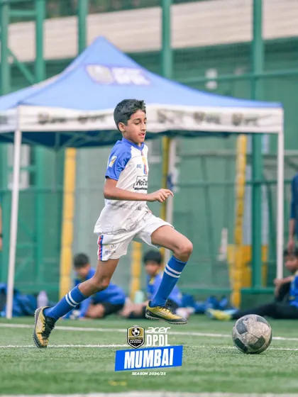 A young player on the run, showcasing agility and focus during a competitive game.