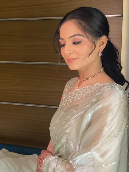 A serene portrait of the bride, her makeup looking elegant and understated.