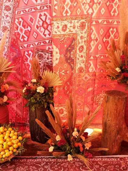 More decor details from the Souk Bazaar, featuring earthy tones, pampas grass, and fresh lemons, all set against a vibrant, patterned backdrop.
