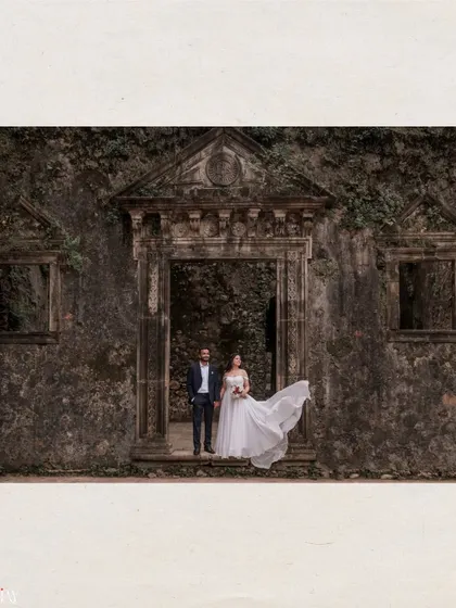A fairytale moment captured at Vasai Fort. The historic ruins and the bride's flowing dress create a dramatic and timeless pre-wedding photograph.