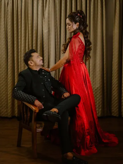 A romantic pose between the couple, showcasing the bride's beautiful side profile and hairstyle.