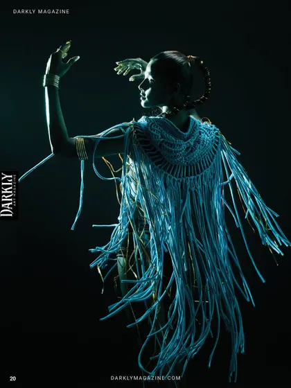 A shot from the "Divine Frequency" series in Darkly Magazine, using UV-reactive elements and blacklight.