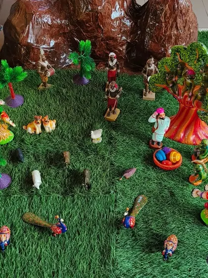A vibrant diorama showcasing a village scene, complete with people, animals, and trees. These projects help children understand communities and the different roles people play within them.