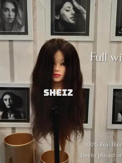 This full wig, displayed on a mannequin, is ready for a client. We offer full customization for all our wig products.