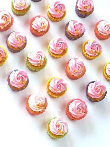 Simple and pretty pink swirl cupcakes in assorted colourful liners. I add a sprinkle of edible gold flakes to each one for a touch of elegance.