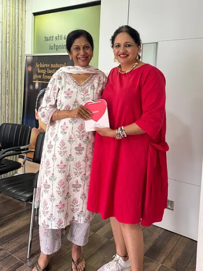 Sharing a moment with a patient during our Valentine's giveaway. I believe skincare is an act of self-love, and I love celebrating that with my clients.