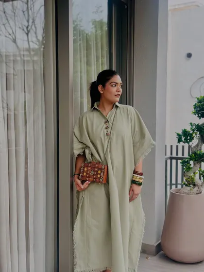 A closer view of the wooden purse, showing its intricate details and craftsmanship.