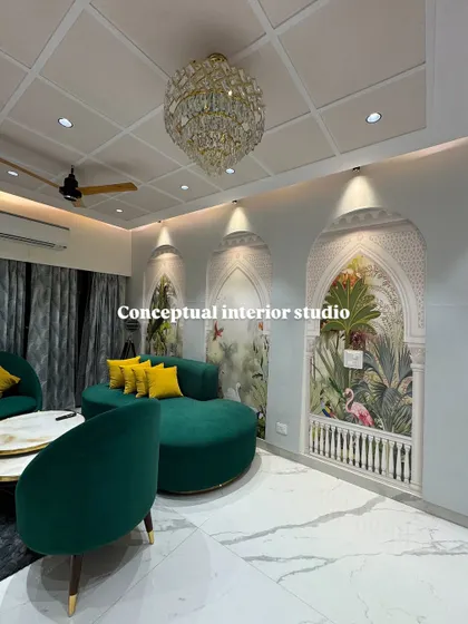 The vibrant green sofa and yellow cushions create a cheerful and inviting atmosphere in this living room, set against the backdrop of artistic, palace-style wall murals.