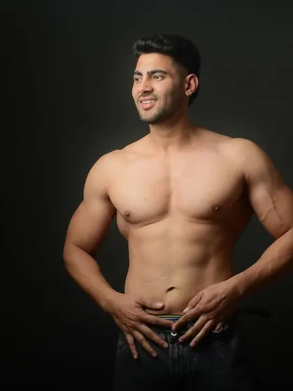 A candid, confident shot of a fitness enthusiast. This relaxed pose shows a different side, highlighting a healthy and positive self-image.