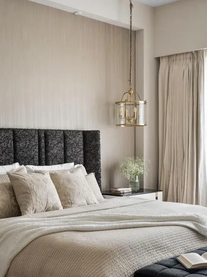 Another view of the master bedroom from the Studio Sylus project, showing the calm, neutral palette and the luxurious texture of our custom headboard.