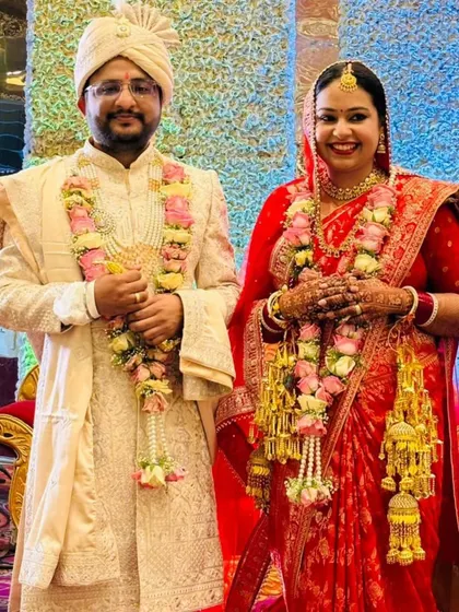 A formal wedding portrait of Jitesh and Pooja. Their union is a beautiful example of a marriage of hearts, where shared values create a strong and lasting bond.