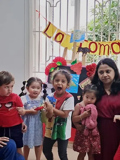 Celebrating La Tomatina! A group photo of children and teachers dressed in red for our fun, messy, and culturally rich festival day.