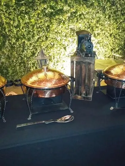 This setup includes a miniature train engine prop, showcasing our ability to incorporate specific thematic elements into the catering display for a personalized touch.