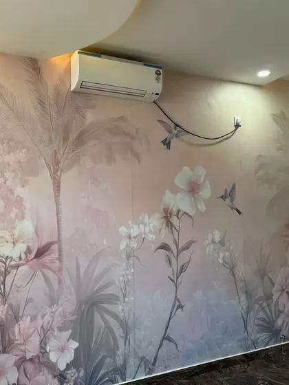 A soft and dreamy pink-toned tropical mural with hummingbirds, creating a gentle and romantic atmosphere in this bedroom.