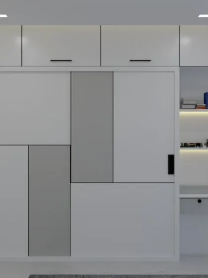 This custom wardrobe combines sliding doors with an open, backlit shelving unit that doubles as a study desk. It's a perfect all-in-one solution for a teenager's room or a compact bedroom.