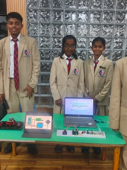 Our students presenting their innovative robotics projects at the Robozest 2.0 competition. We encourage hands-on learning in STEM fields to foster problem-solving skills.