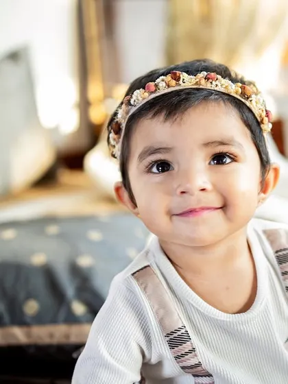 That sweet, knowing smile from a toddler is just heart-melting. These close-up portraits really let their adorable personality shine through.