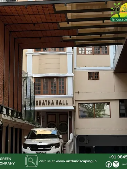 Our work extends to commercial and community spaces. This image shows a large-scale entrance pergola we designed for Akshatha Hall, featuring a unique combination of tinted glass roofing and vertical clay tile cladding for a bold, modern aesthetic.