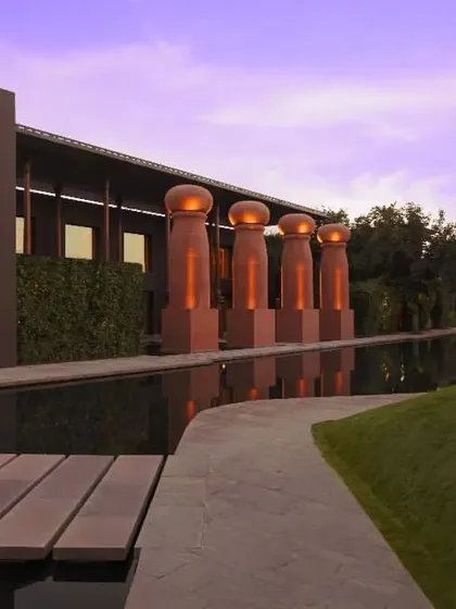 The resort at twilight, with its blend of modern architecture and natural landscapes. It is an ideal setting for quiet evening get-togethers or a peaceful stroll.