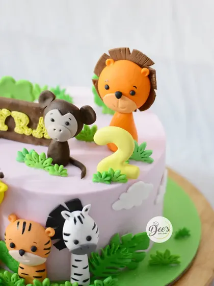 A close-up on the friendly lion and monkey toppers, each one sculpted with care.