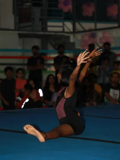A student holds a perfect split position on the floor during a routine. These events build confidence and give our gymnasts a chance to perform.