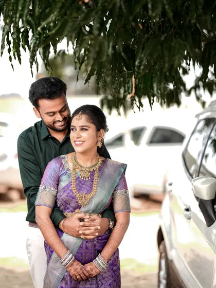 A happy, relaxed portrait of the couple during their outdoor shoot in Palladam.