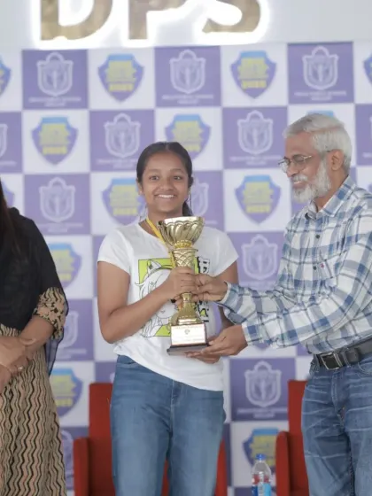 Harini receiving the Best Shooter award trophy at the CBSE South Zone Competition. This award recognizes her as the top scorer across all age categories, both boys and girls.