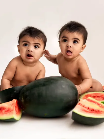 A fun and fruity watermelon-themed shoot for these twin boys. Their identical looks of surprise are absolutely priceless and make for a memorable photo.