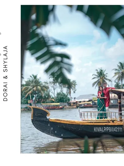 A beautiful shot of the couple on a houseboat in the Alleppey backwaters, marking the beginning of their new journey together in a classic Kerala setting.