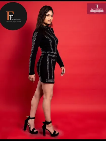 A full-length shot of the model, showing how our students' work contributes to a complete, polished fashion look.