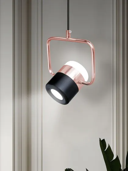 A clean shot of the adjustable spotlight pendant, showing its modern design and rose gold finish.