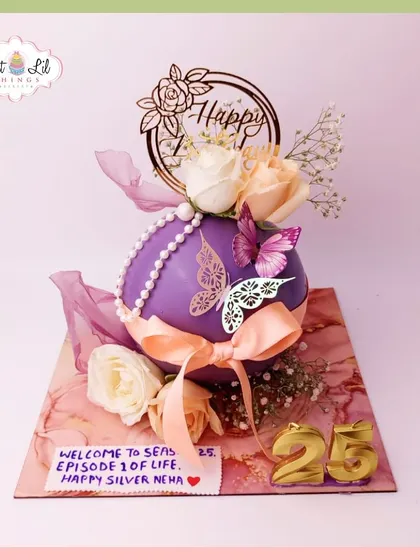 Another view of the unique spherical cake celebrating "Happy Silver Neha" on her 25th birthday.