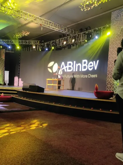 A behind-the-scenes look at the scale of production for the ABInBev corporate event, with professional lighting and videography capturing the show.