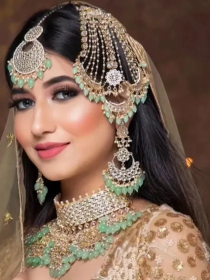 A beautiful pastel look with a mint green beaded set. This is a popular choice for modern brides.
