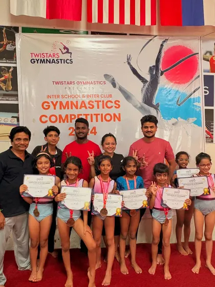 Our team and coaches posing proudly at the Twisters Inter-School & Inter-Club Gymnastics Competition. These events are a fantastic experience for our athletes.