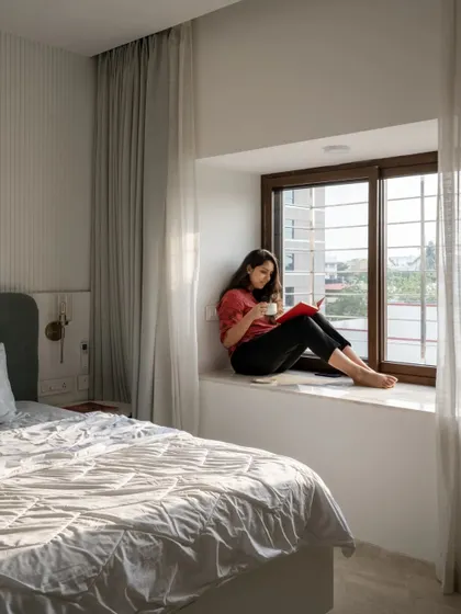 Natural light was a key element in this project. Here, the morning sun streams into the bedroom, creating a bright and energizing start to the day.