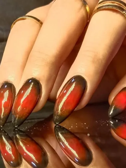 A close-up of the intense red and black cat-eye effect, showing the magnetic shimmer.