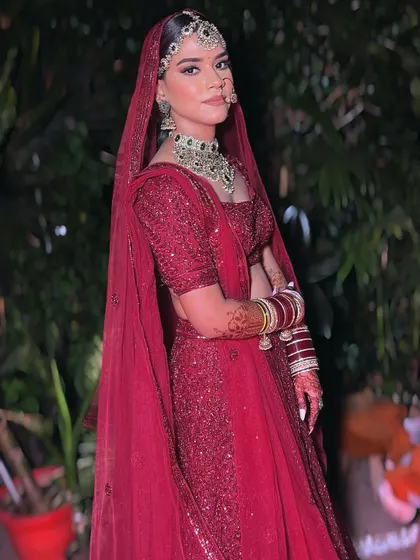 The full bridal look for Noor, showcasing the perfect draping of her dupatta and how the makeup complements her entire ensemble. My goal is to ensure you look flawless from head to toe.