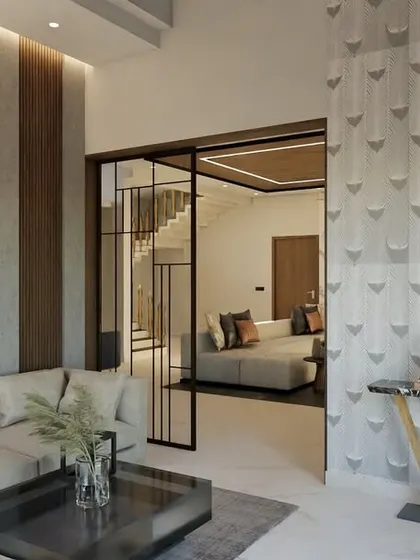 This living room design for my client Manjunath combines multiple textures for a rich, layered look. I used marble paneling, wooden flutes, and textured paint alongside a metal and glass partition to create a space that is both luxurious and welcoming.