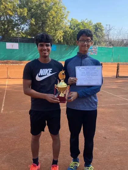 Riddhiman Ojha celebrating a successful week, winning the CS7 Under-16 Singles and finishing as runner-up in Doubles. This showcases his strength in both formats of the game.