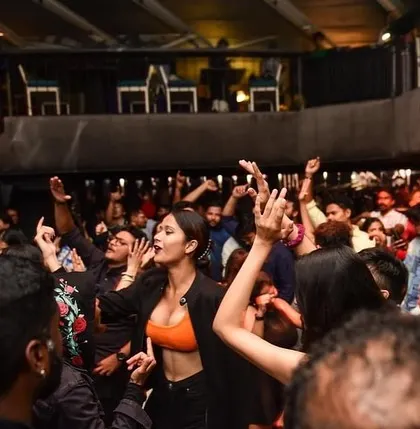 The crowd with their hands in the air. This is the energy that defines a Saturday night at Flo.