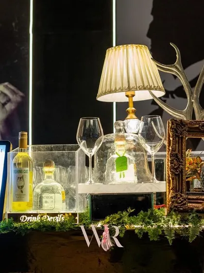 Details of the Jazz Club bar, featuring a "Godfather" portrait and other quirky, thematic elements that add personality and a sense of fun to the sophisticated setup.