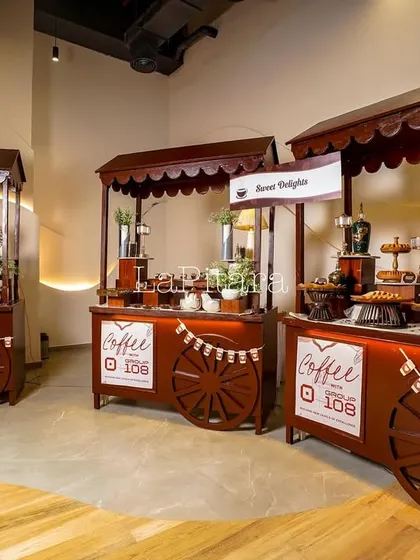 A view of the custom-built food carts, each designed with a rustic wooden finish and branded with the event logo. These carts housed different delights, creating a cohesive and organized food festival experience.