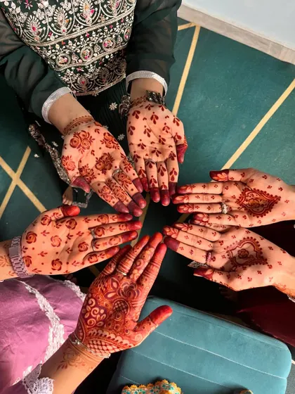 The joy of celebrating together with hands full of mehndi. Each design is unique to the person wearing it.