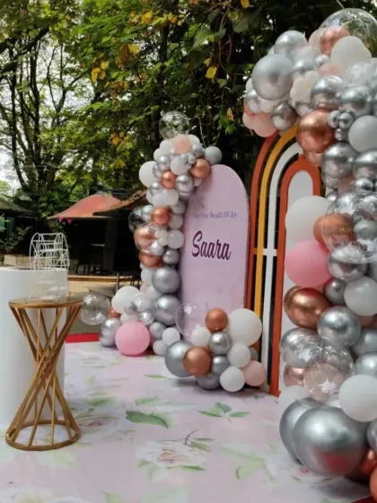 Another perspective of the outdoor naming ceremony setup, showing how the elements are arranged to create a beautiful and balanced focal point for the event.