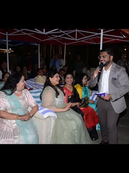 Interacting with the guests during a Sangeet. I make it a point to move around the room and engage with everyone, not just stay on stage.