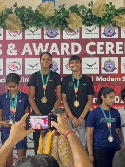 My girls on the podium after winning gold in the doubles category. Their synchronization and on-court strategy were flawless.